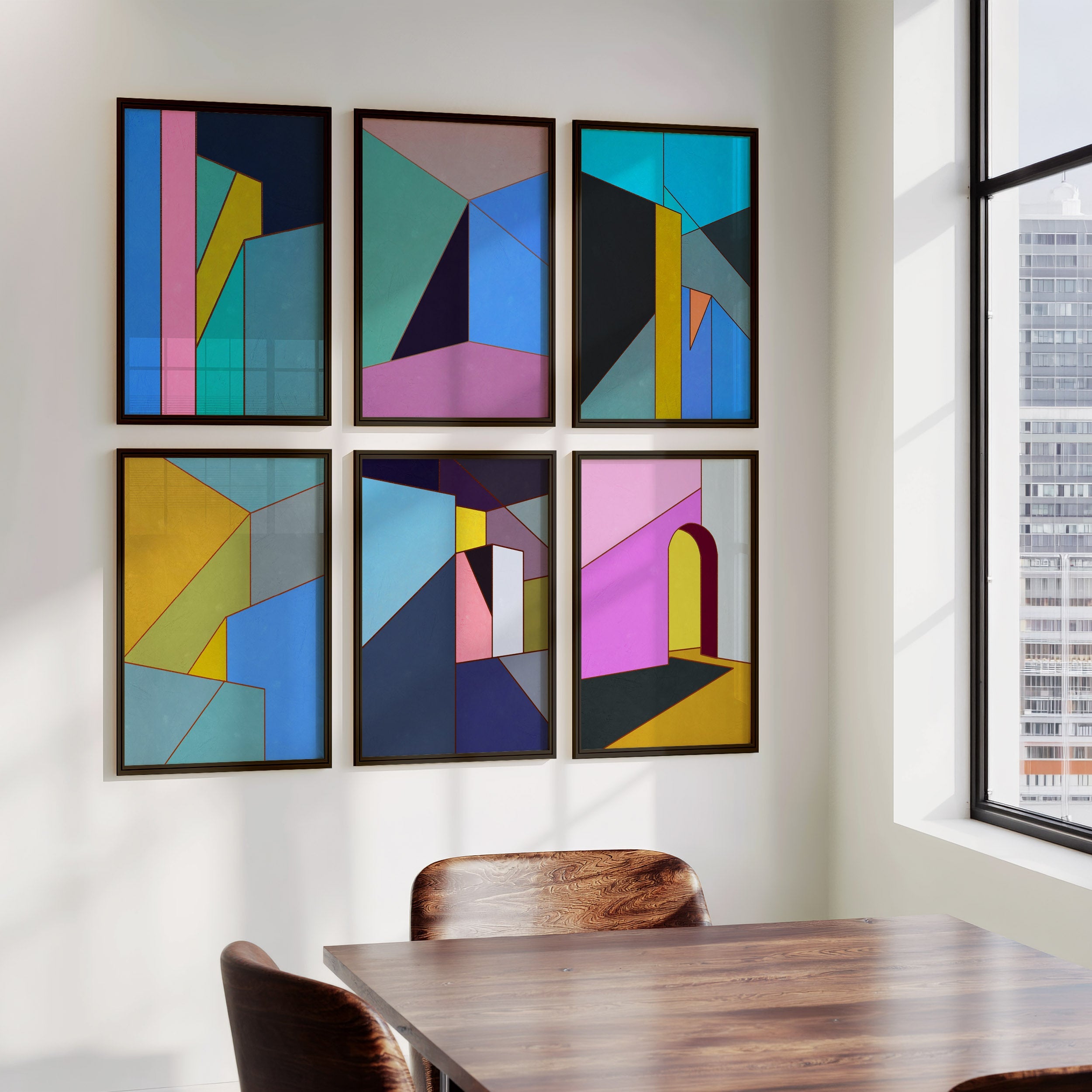Geometric abstract giclée prints from the Constructed Fields collection by Open Wall Studio displayed in a contemporary dining interior.