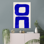 Vertical abstract wall art print displayed in minimalist living room interior